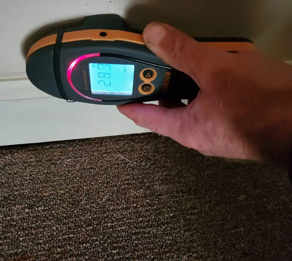 Moisture detection at baseboard during Storm Damage Restoration in Pleasant View